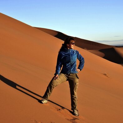 A beautiful girl in Merzouga desert during the 5-day Morocco tour from Fes to Marrakech