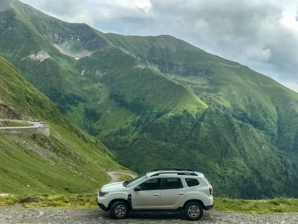 A Dacia rental car in the mountains
