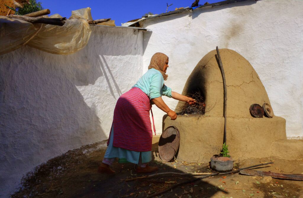 Moroccan woman cooking bread