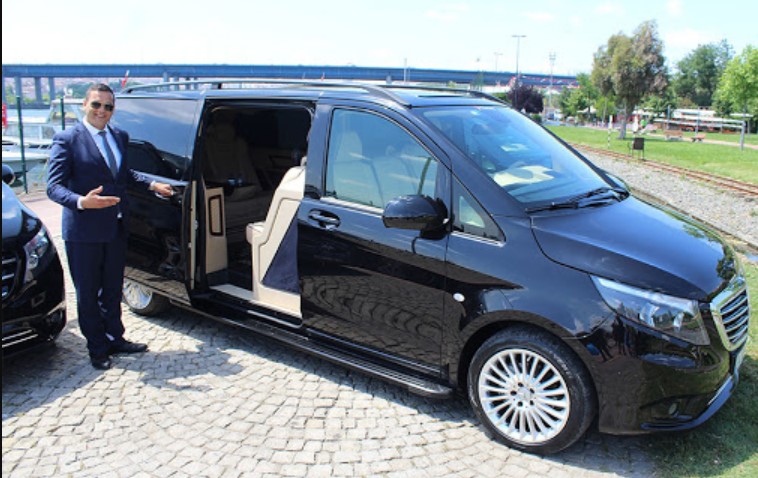 A luxury Mercedes Vito car with its driver for hiring in Morocco.