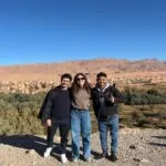 Travelers with local driver enjoying valley stop during the 3 days tour from marrakech to merzouga