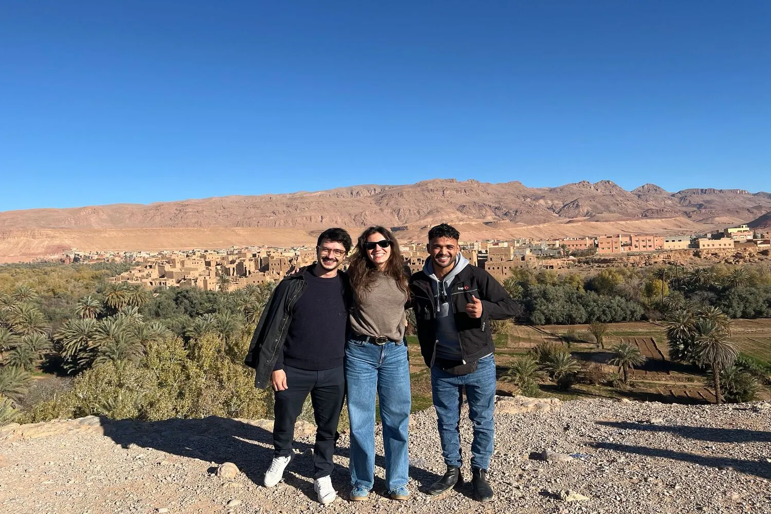 Tourists with a driver during the tour from Marrakech to Merzouga desert of 3 days