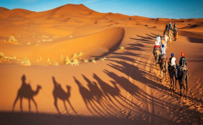 Camel trekking in Merzouga desert during the 4 Day Morocco Tour from Casablanca.